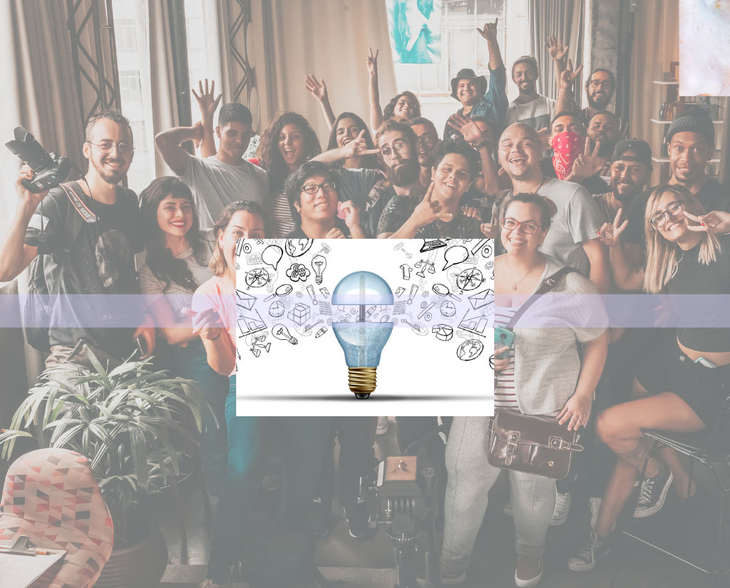 A diverse group of people in a room. There is a drawing overlaid of a lightbulb opening up with symbols coming out, depicting ideas.